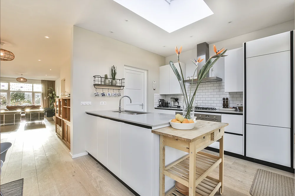 Kitchen island and rooflight inside a finished Superstrux extension