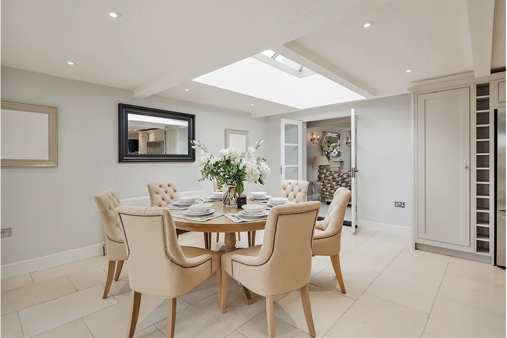 Formal dining room with roof lantern in a Superstrux extension